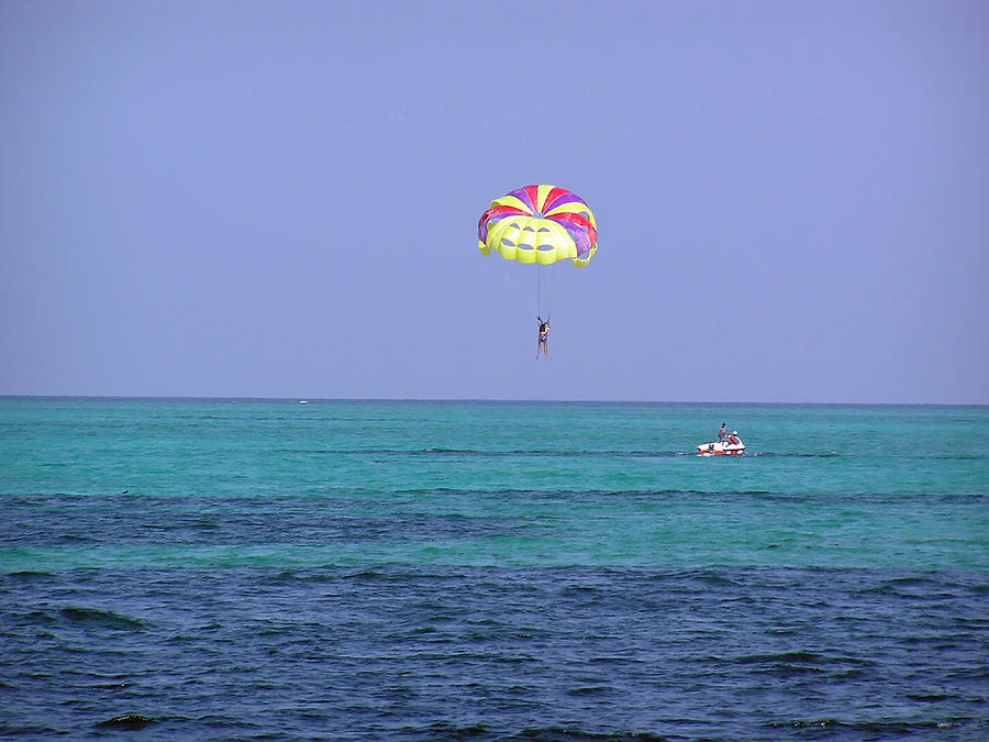Preparing to land in the water after parasailing in the Lakshadweep Islands Photograph by Ashish Agarwal