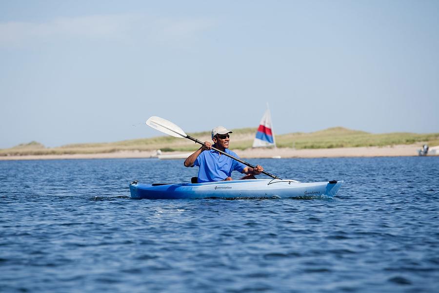 Politician Photograph - President Barack Obama Kayaks While by Everett