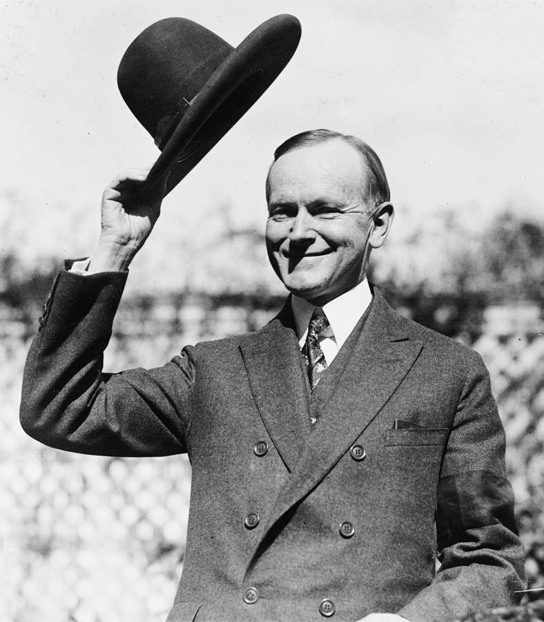 Portrait Photograph - President Calvin Coolidge tips is hat by International  Images