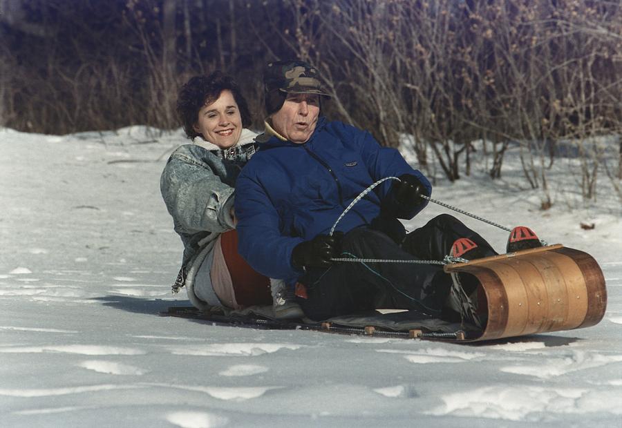 Winter Photograph - President George Bush Goes Sledding by Everett