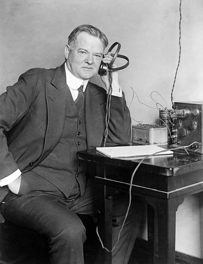 President Herbert Hoover listens to the radio Photograph by International  Images