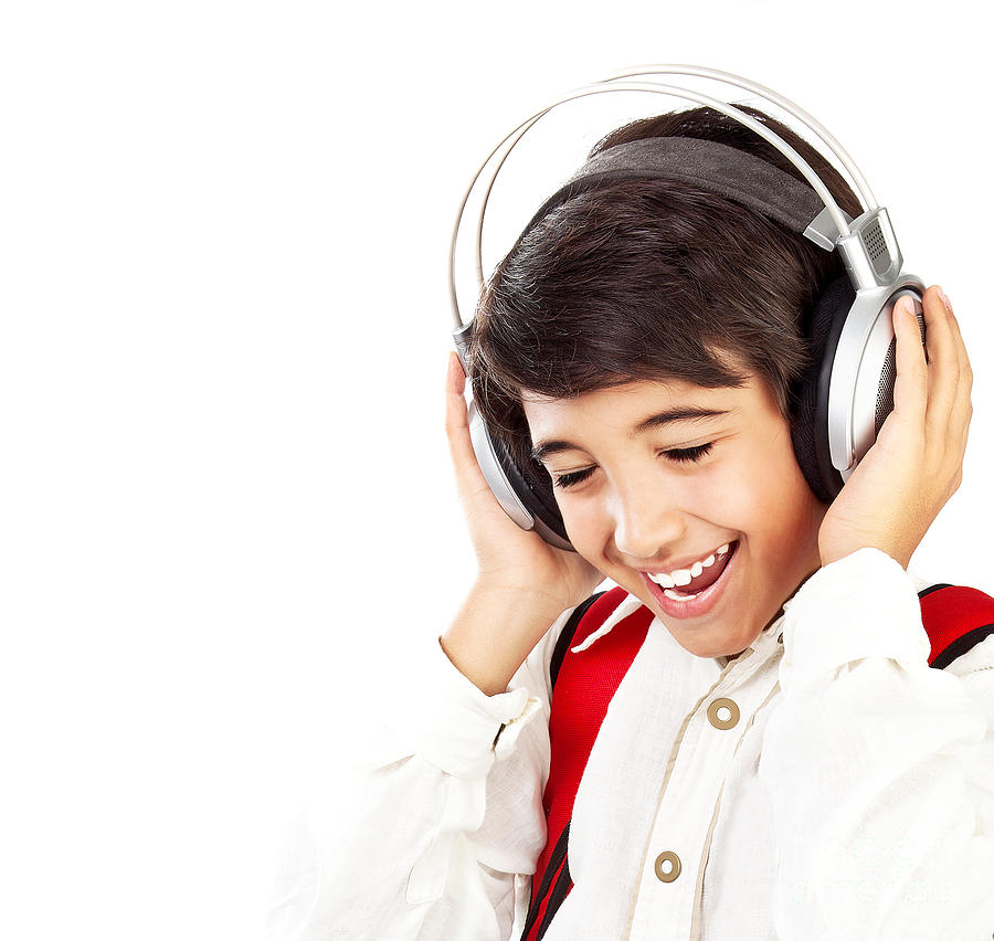 Pretty teen boy enjoying music Photograph by Anna Om