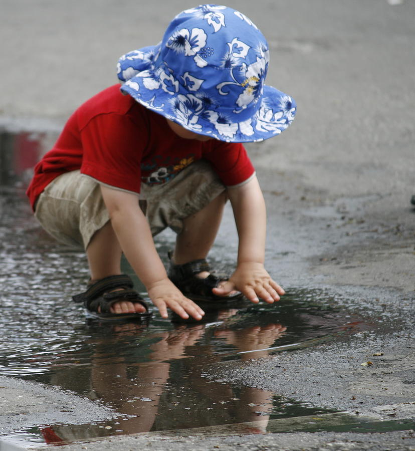 Puddles of Fun Photograph by Jale Fancey