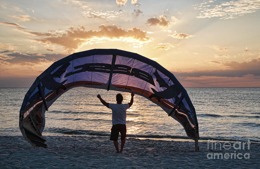 Putting Away the Kite At Clam Pass at Naples Florida Photograph by William Kuta