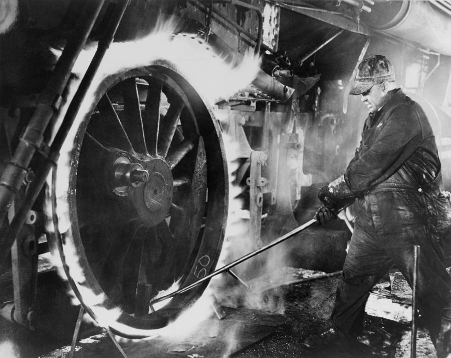 Railroad Worker Sweating A Tire Photograph by Everett Railroad Worker Sweating A Tire Photograph by Everett