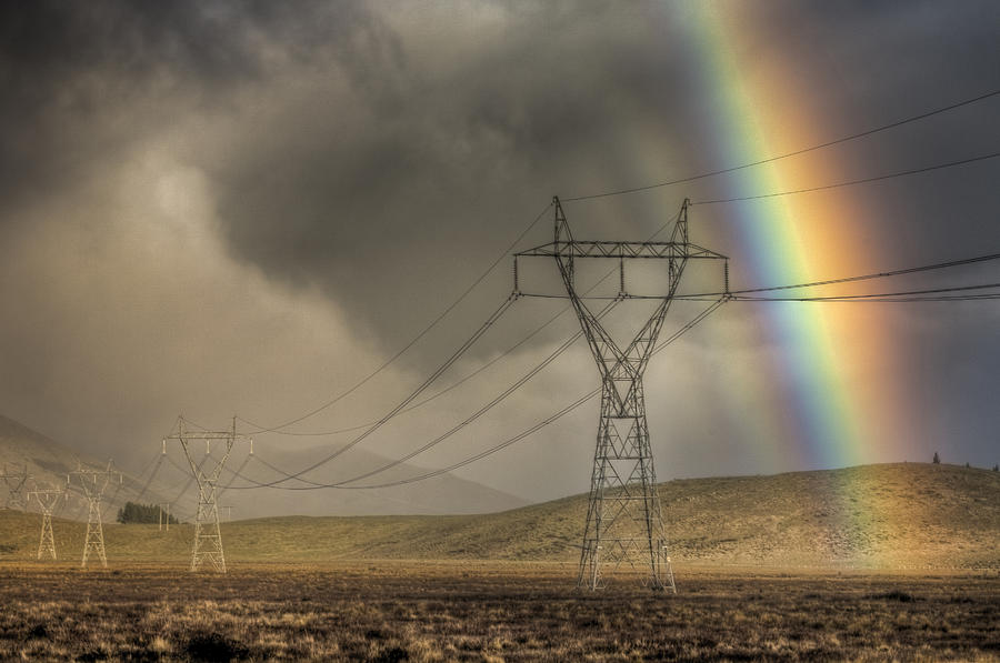 Rainbow Over Powerlines Photograph by Colin Monteath