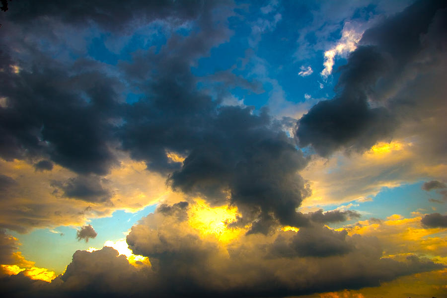 Receding storm cloud Photograph by John Bartosik