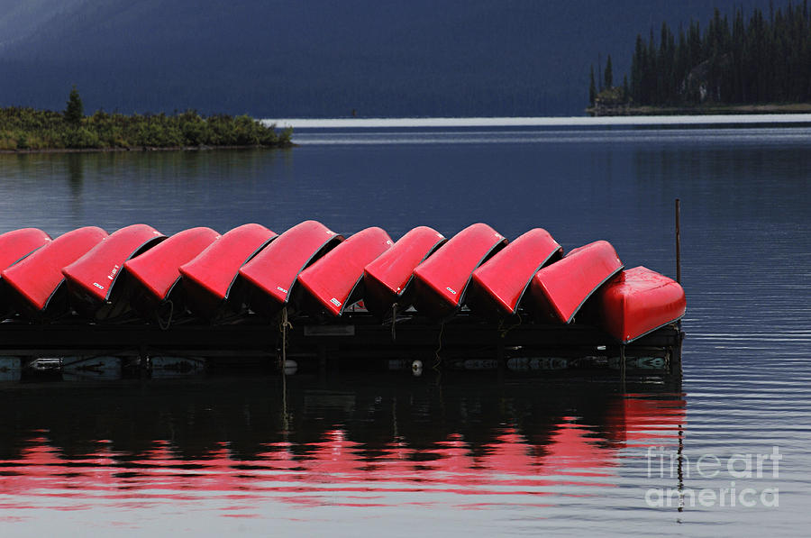 Red Canoes Maligne Lake Photograph by Bob Christopher