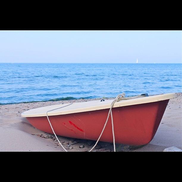 Boat Photograph - Red Sailboat on the Beach by Justin Connor