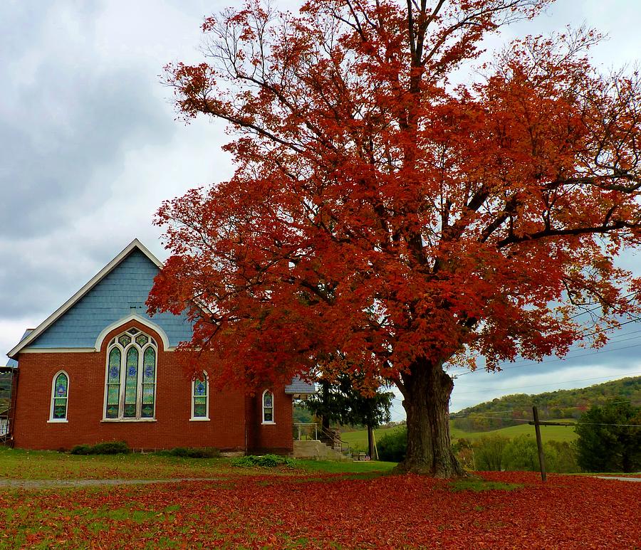 Red Tree by the Church Photograph by Jeanette Oberholtzer