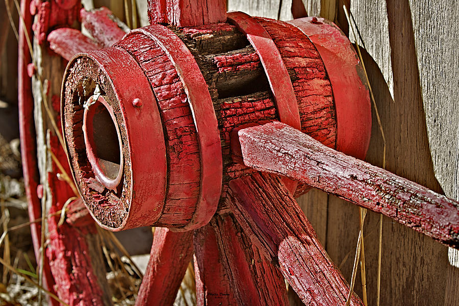 Red Wooden Wheel Hub Photograph by Phyllis Denton