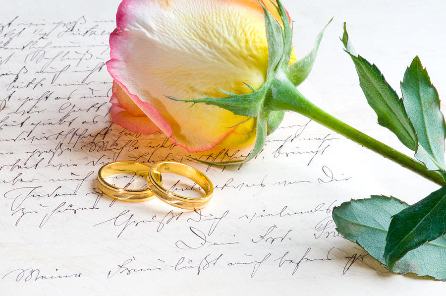 Red yellow rose and ring over a hand written letter Photograph by U Schade