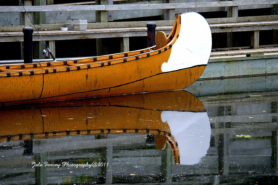 Reflection of a Canoe Photograph by Jale Fancey