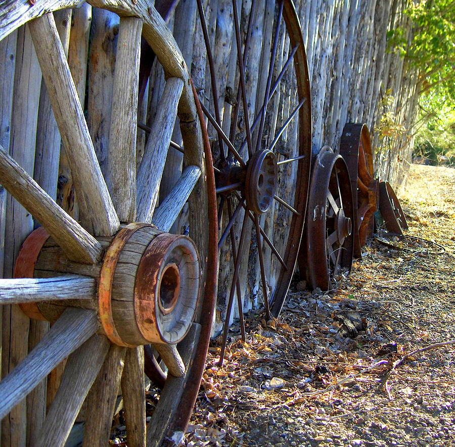 Retired Wagon Wheels Photograph by Donna Spadola
