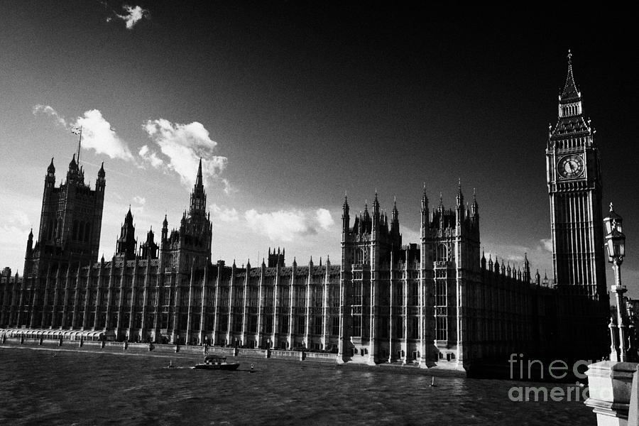 Westminster Photograph - river thames police security boat palace of westminster houses of parliament buildings London by Joe Fox