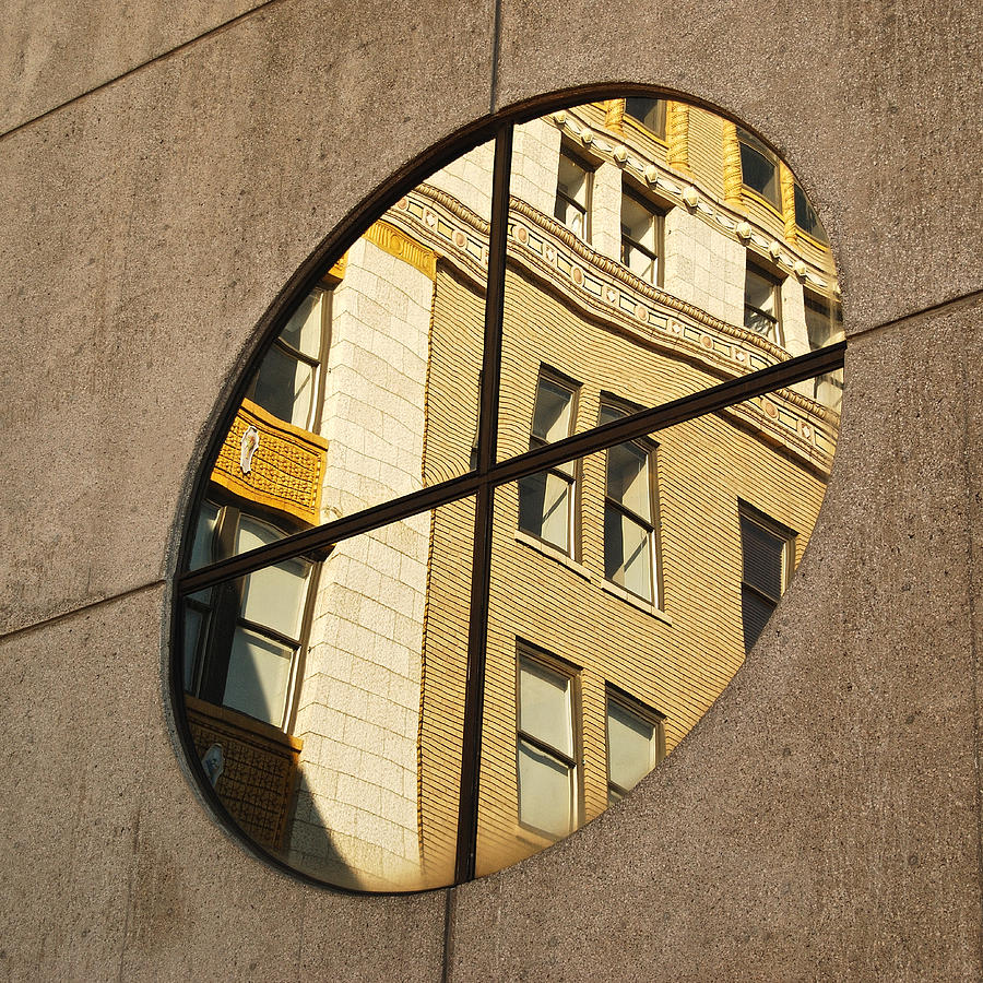 Round window reflection  Photograph by Michael Peychich