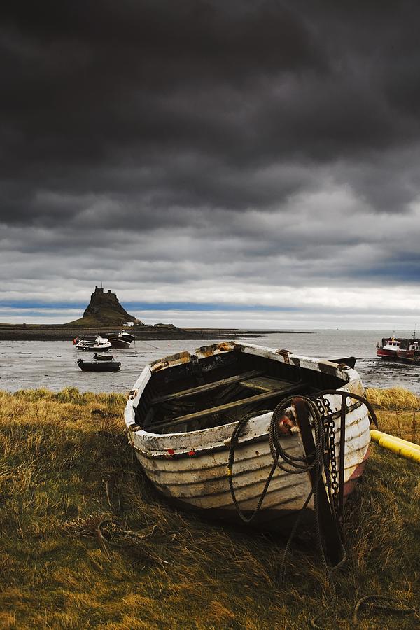 Boat Photograph - Row Boat On Volcanic Shore by John Short