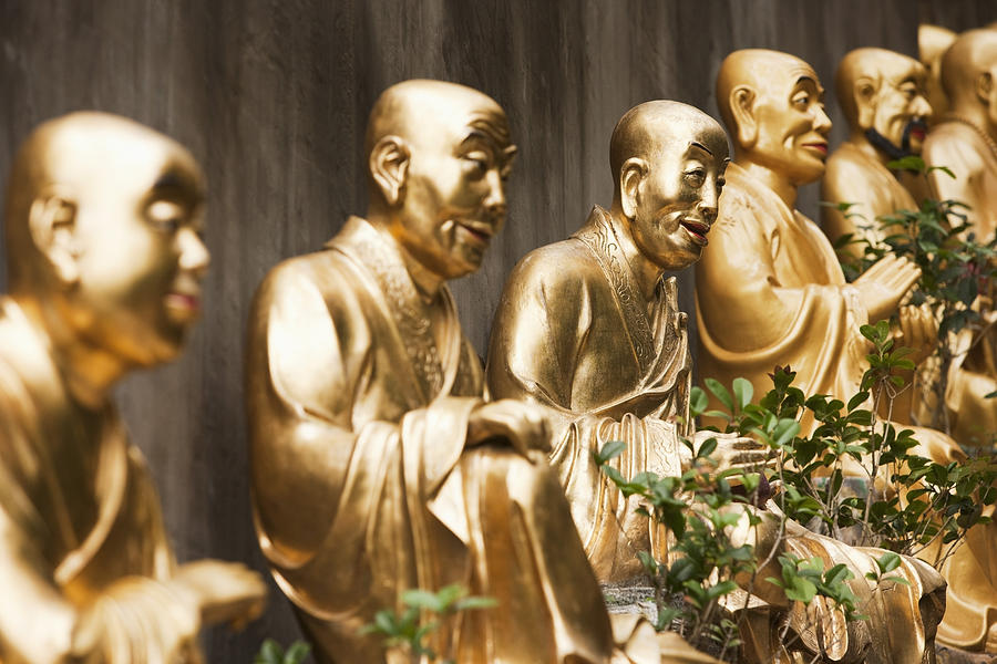 Row Of Golden Buddha Statues Photograph by Wilfried Krecichwost