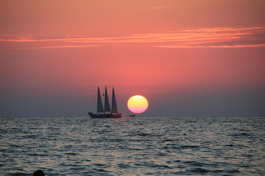Sailing away from the Sun Photograph by RobLew Photography