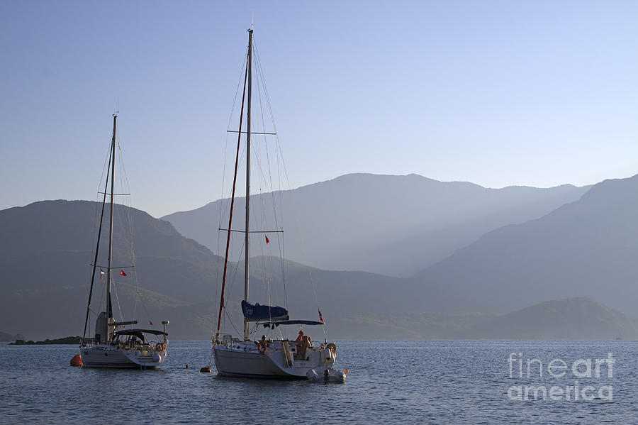 Turkey Photograph - Sailing boats at dawn in Karacaoren Bay by Louise Heusinkveld
