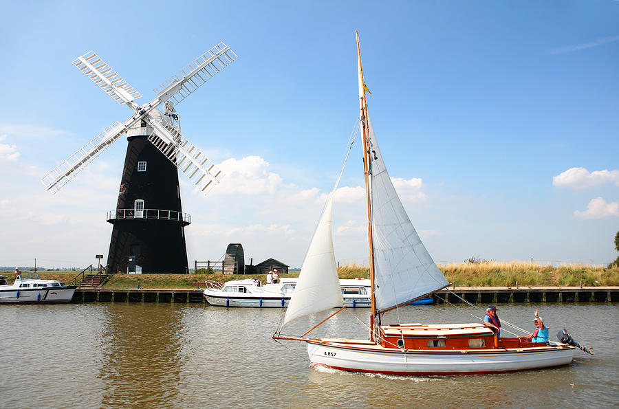 Sailing by Berney Arms windmill Photograph by Paul Cowan
