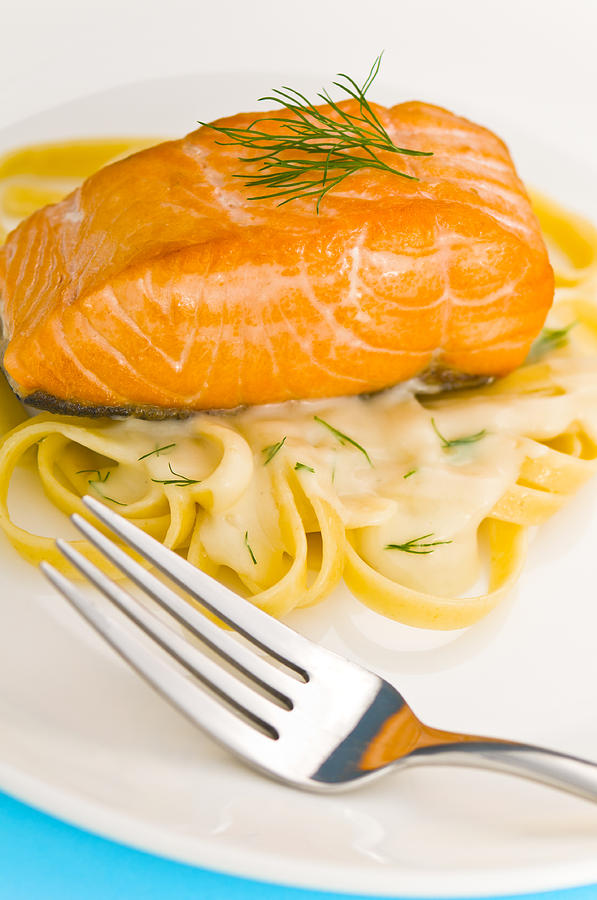 Salmon steak on pasta decorated with dill Photograph by U Schade