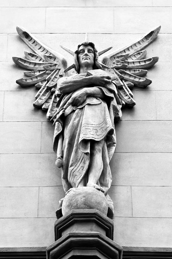 Sandstone figure as exterior decoration with wings Photograph by U Schade