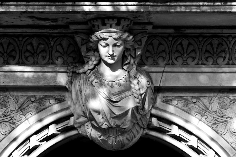 Sandstone woman figure as exterior decoration above an entrance Photograph by U Schade