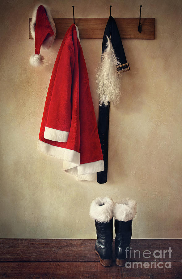 Santa costume with boots on coathook Photograph by Sandra Cunningham