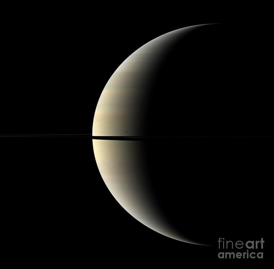 Saturn And Its Moon Mimas Photograph by NASA/Science Source