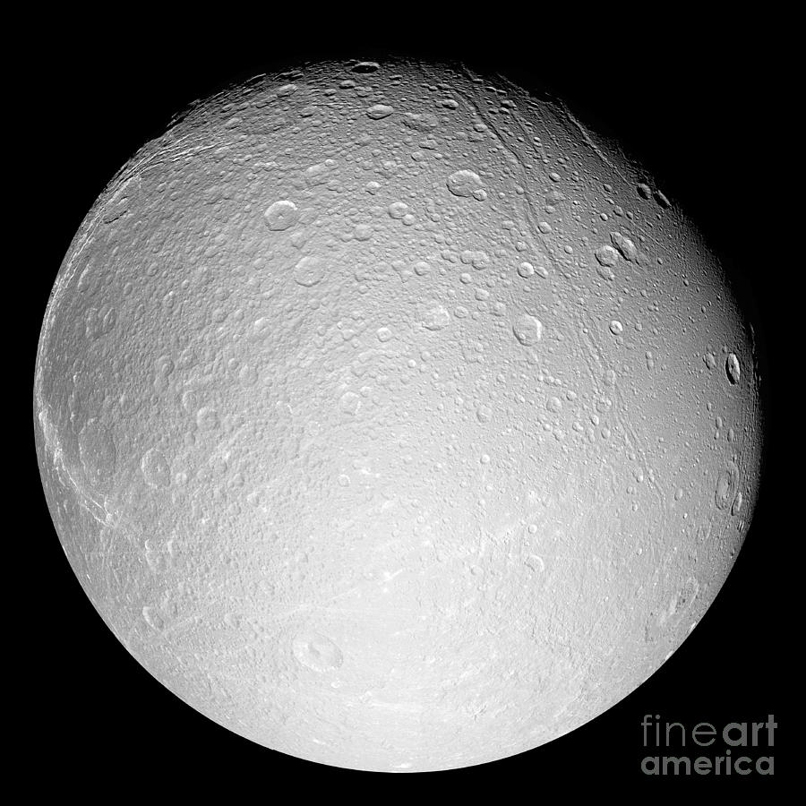 Black And White Photograph - Saturns Moon Dione by Stocktrek Images