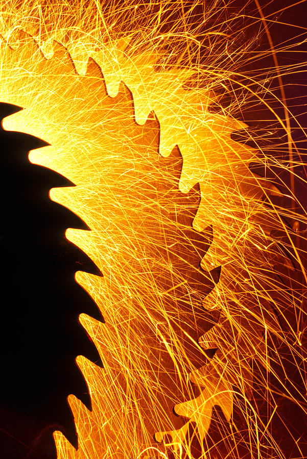 Saw blades with sparks Photograph by Garry Gay