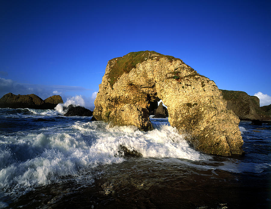 Sea Arch At Ballintoy On The North Photograph by Chris Hill