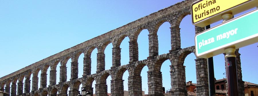 Segovia Ancient Roman Aqueduct V A Water Conveyance Granite Stone Structure With Arches in Spain Photograph by John Shiron