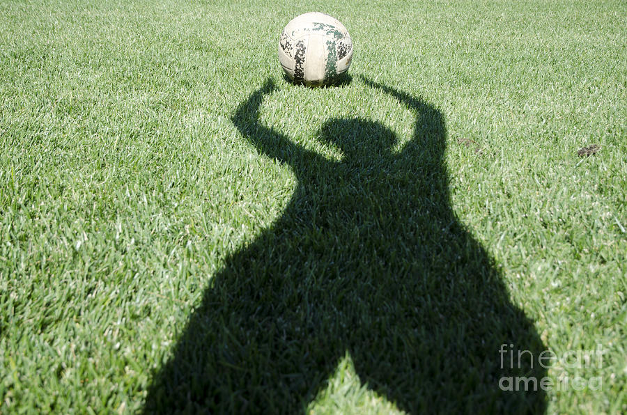 Shadow playing football Photograph by Mats Silvan