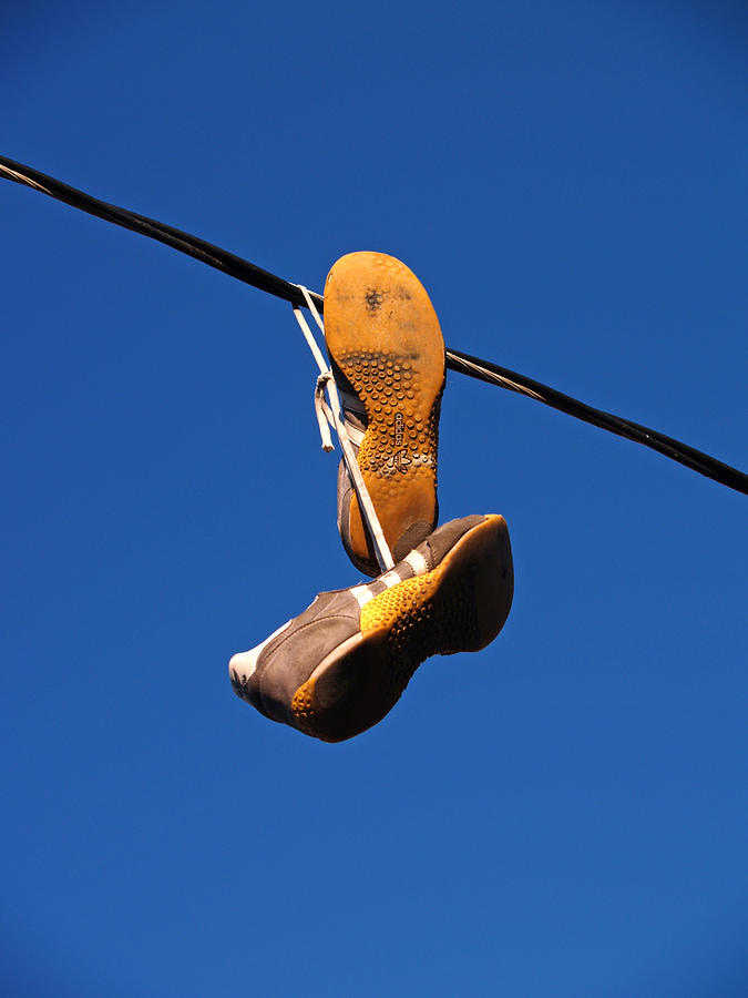 Shoes on a Wire I Photograph by Ashley Cabulagan