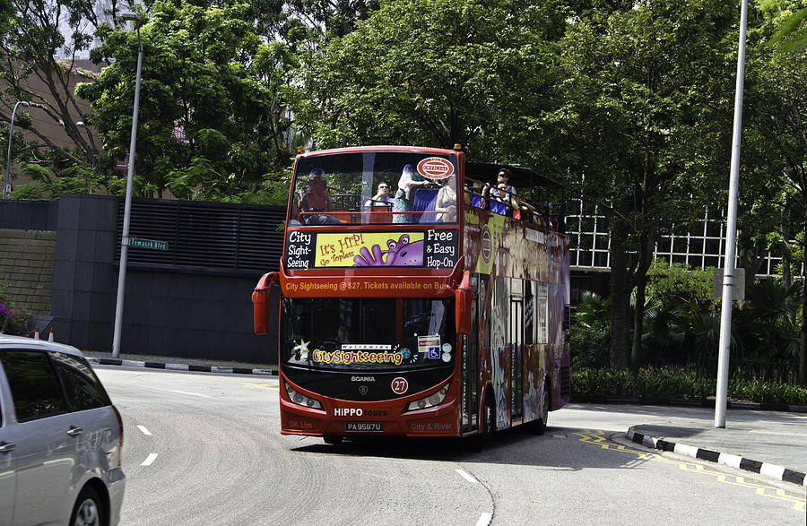 Sightseeing bus at the Suntec Mall in Singapore Photograph by Ashish Agarwal