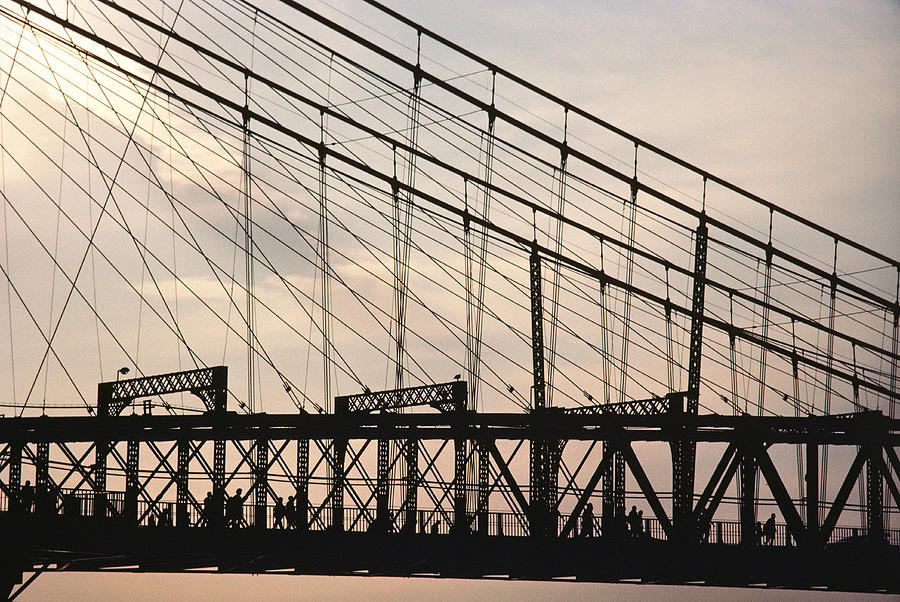 Silhouette Of A Suspension Bridge Photograph by Kenneth Garrett