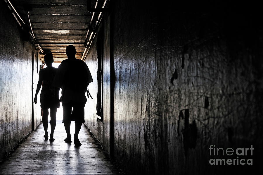 Silhouettes of couple walking in a dark corridor Photograph by Sami Sarkis Photography Silhouettes of couple walking in a dark corridor Photograph by Sami Sarkis Photography