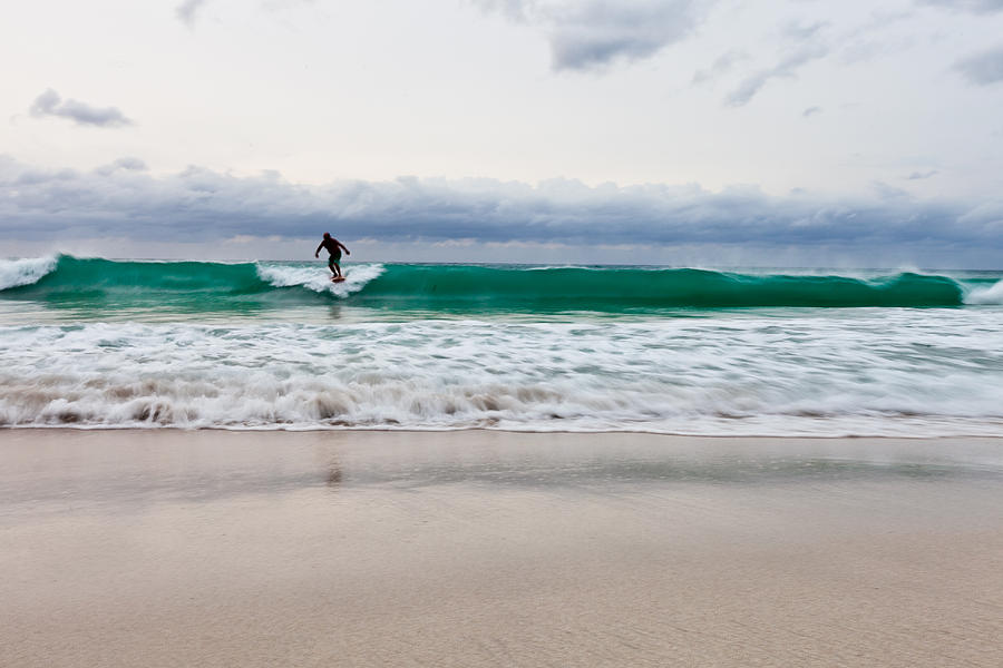 Beach Photograph - Single surfer on the waves on an overcast day by Anya Brewley schultheiss