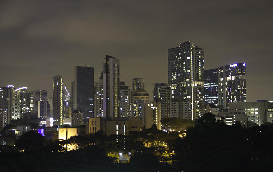 Skyline of Singapore at night as seen from an apartment complex Photograph by Ashish Agarwal