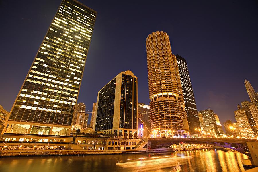 Architecture Photograph - Skyscrapers Along Chicago River At Night by Axiom Photographic