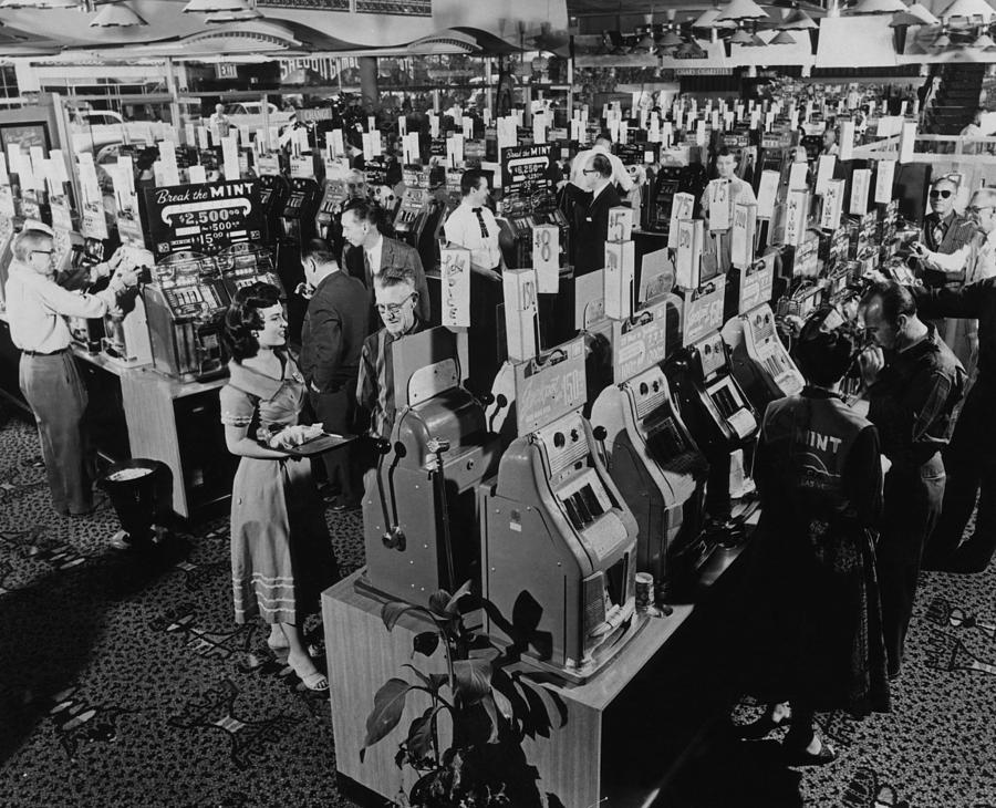 Las Vegas Photograph - Slot Machines At A Casino In Las Vegas by Everett