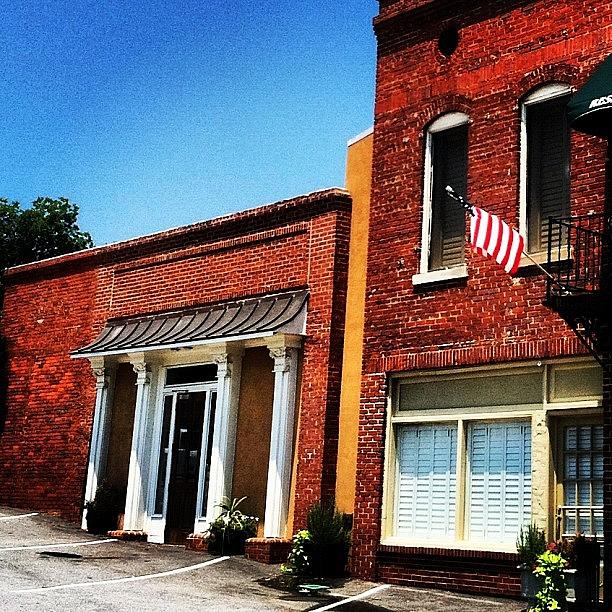 Summer Photograph - #smalltown #usa #flag #brick #building by Lori Lynn Gager