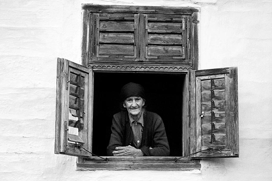 Smiling at the window Photograph by Emanuel Tanjala