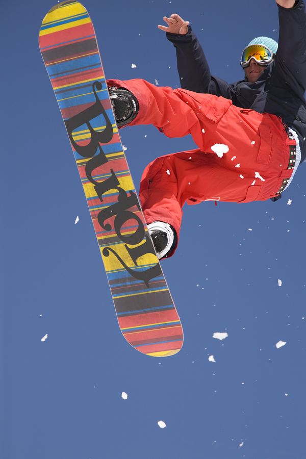Snowboard jumping on Vogel mountain Photograph by Ian Middleton Fine