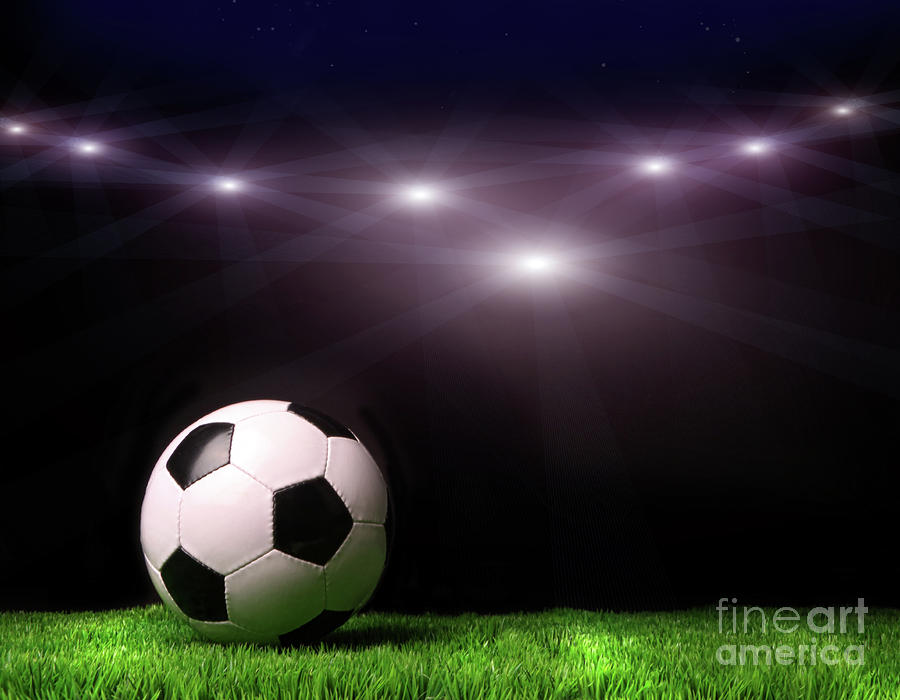 Soccer ball on grass against black Photograph by Sandra Cunningham