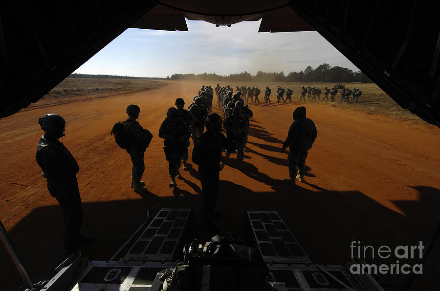 Soldiers Board A C-130 Hercules Photograph by Stocktrek Images