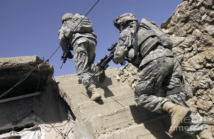 Soldiers Running Up Staircase Photograph by Stocktrek Images
