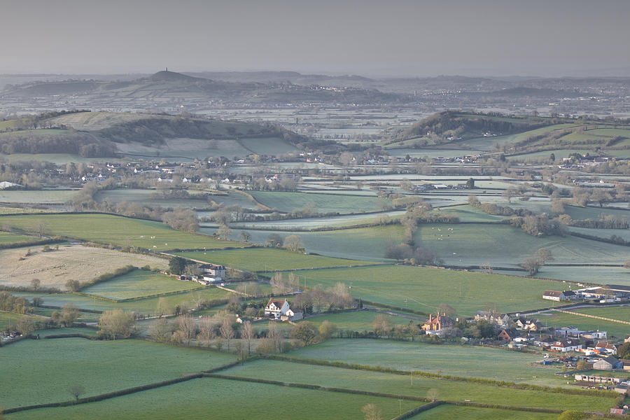 Somerset Levels And Glastonbury Tor From Deer Leap Photograph by Julian Elliott Ethereal Light